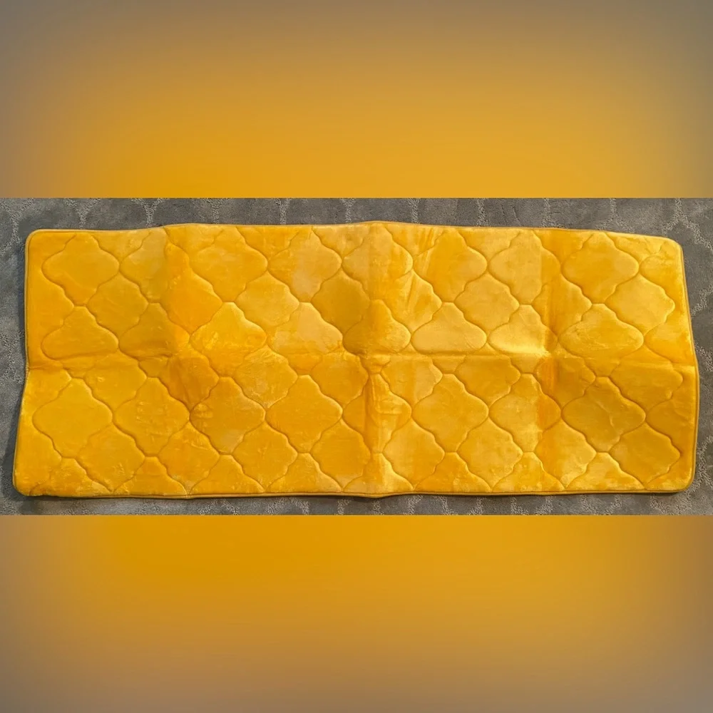 Yellow memory foam bath mat.